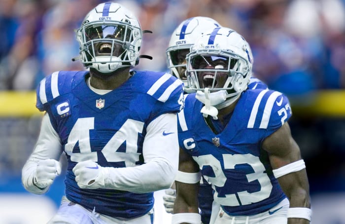 Oct 2, 2022; Indianapolis, Indiana, USA; Indianapolis Colts linebacker Zaire Franklin (44) and cornerback Kenny Moore II (23) celebrate after a tackle on Tennessee Titans quarterback Ryan Tannehill (not pictured) at Lucas Oil Stadium.